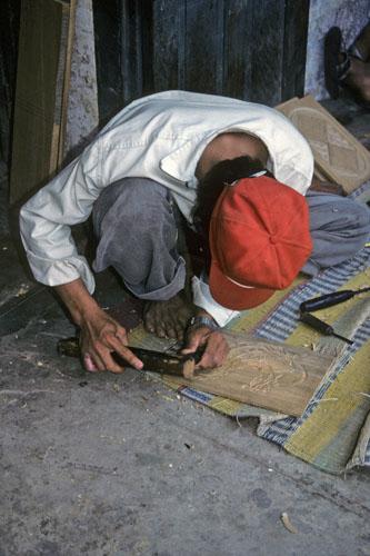 <img typeof="foaf:Image" src="http://statelibrarync.org/learnnc/sites/default/files/images/vietnam_113.jpg" width="333" height="500" alt="Man carving wood plaque for sale at handicraft workshop in Hoi An" title="Man carving wood plaque for sale at handicraft workshop in Hoi An" />