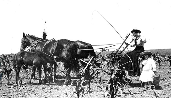 Mother and daughter farming in the fields near Crabtree Creek in what is now Umstead State Park, ca. 1900. From the collection of North Carolina State Parks.