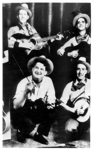 "J.E. Mainer's Mountaineers."  Photograph, [no date]. Call No. 923, Southern Folklife Collection, Wilson Library, University of North Carolina at Chapel Hill.  Used by permission from the Southern Folklife Collection.  [Top left: Ollie Bunn; Right: Zeke Morris; Bottom left: J.E. Mainer; Botton Right: Wade Mainer.] 