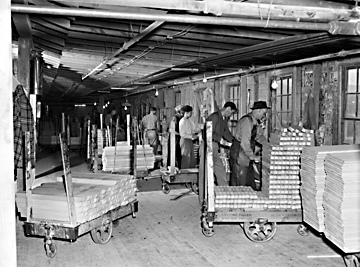 Jennings Furniture Company, Lenoir, NC (Caldwell County); assembling and crating bedroom furniture, 1940s, photo by Patrick. From North Carolina Conservation and Development Department, Travel and Tourism Division photo files, North Carolina State Archives, call #:  ConDev3192C. 