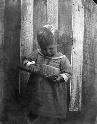 Ernest Davis opening an oyster, Cape Hatteras, NC, no date (c.1900s). Brimley Photograph Collection, PhC.42, North Carolina State Archives, call #:  PhC42.Bx8.Cape Hatteras.F73. 