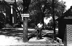 View of water fountain with "colored" sign